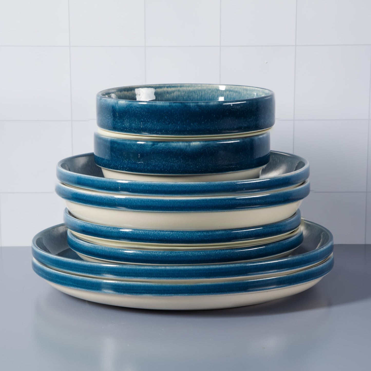Sur La Table Kitchen Essentials Banquette 16 Piece Double Bowl Plates and Bowls Reactive Glaze Stoneware Dinnerware Set - Blue